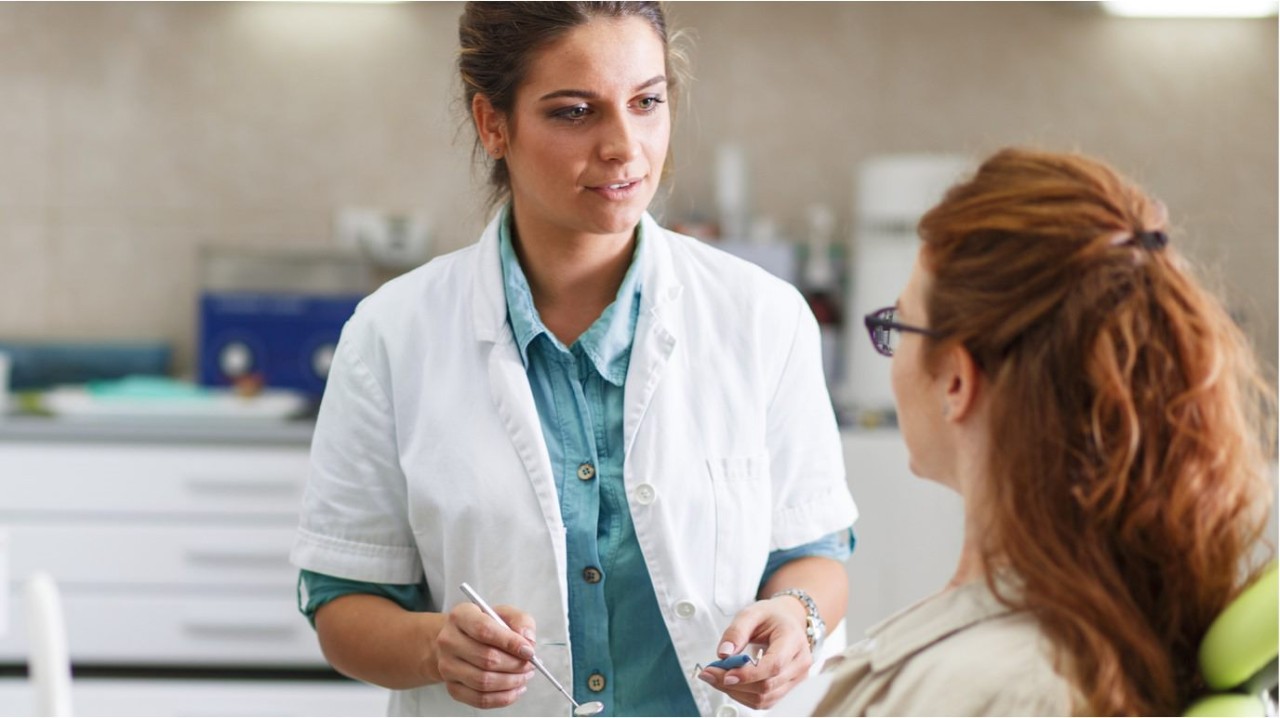 Doctor speaking with a patient in the doctor’s office